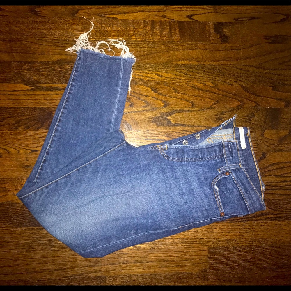 LEVI high waist wedgie jeans with frayed edges and button front